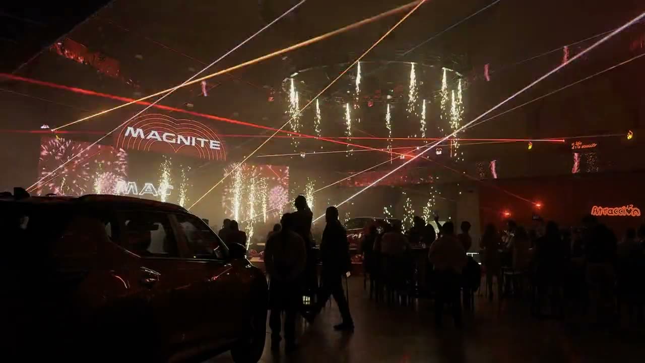 Cold spark fountains firing indoors during a product launch